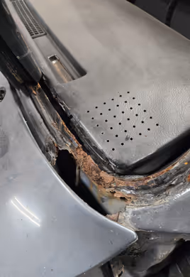 A view of a newly installed rocker panel repair from the inside, showing clean fabrication and fitment before final welding.