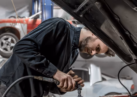 Dan brushing down repaired bodywork before the next fabrication step.