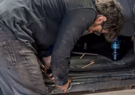 Close-up of door frame grinding and repair work