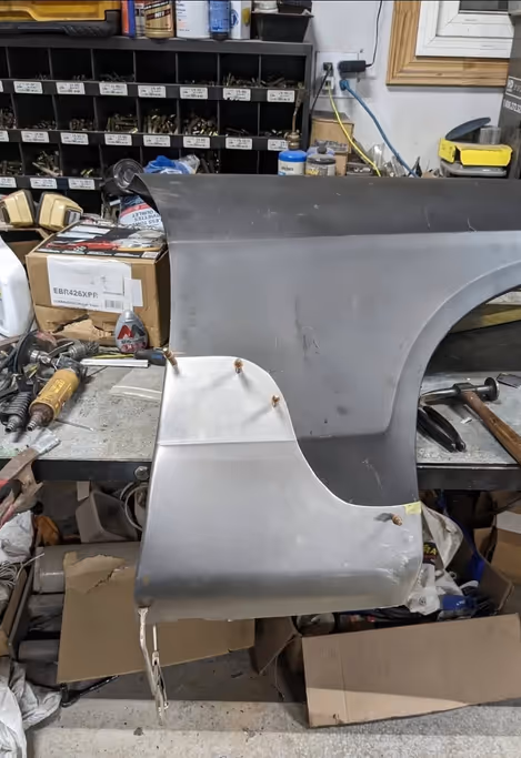 Freshly repaired metal after rust removal and welding.